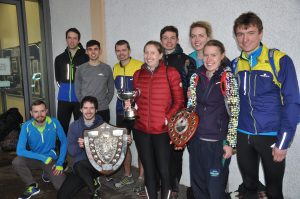 Team members with their trophies