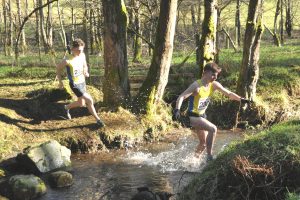 Lewis Dow leads Finlay Muir across the burn cross but it was Finlay who came out on top