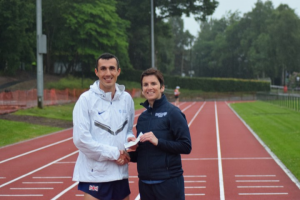 Ben Greenwood receives his prize from Cathy Gallagher
